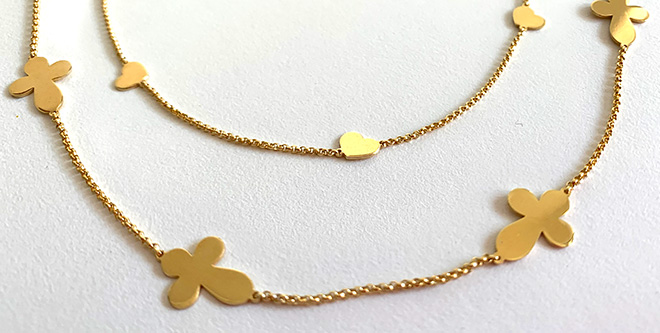 Golden necklace with crosses and hearts